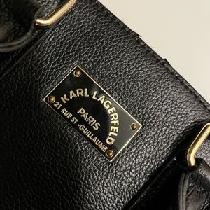 Small hand held Karl Lagerfeld purse . In great condition